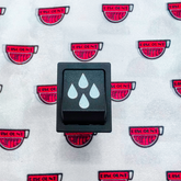 INTERRUPTOR PULSANTE NEGRO SERIGRAFÍA AGUA WEGA 16A 250V